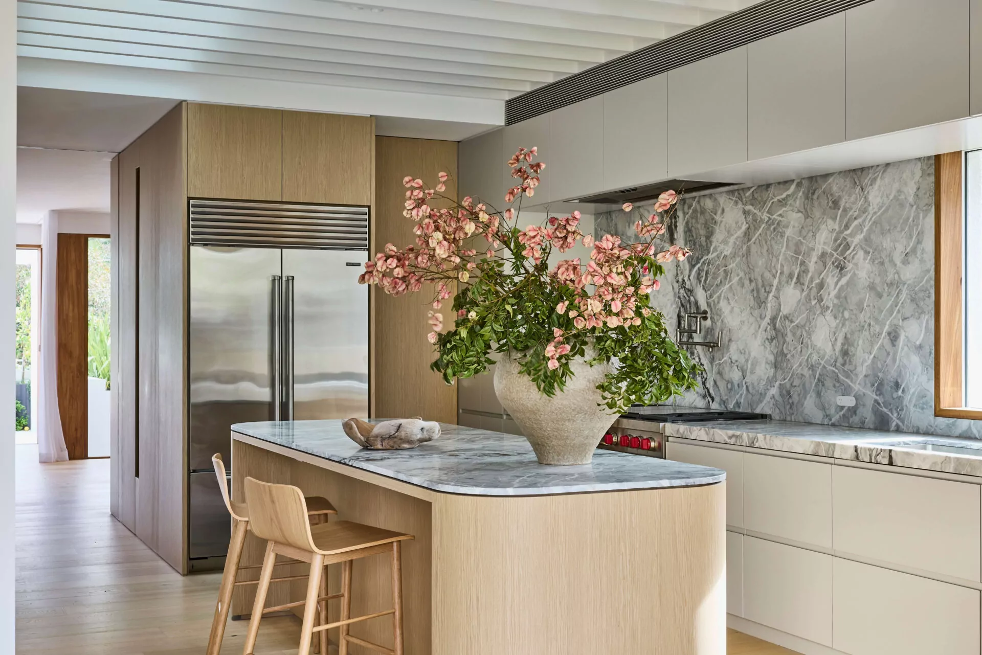 Curved kitchen joinery with marble benchtop