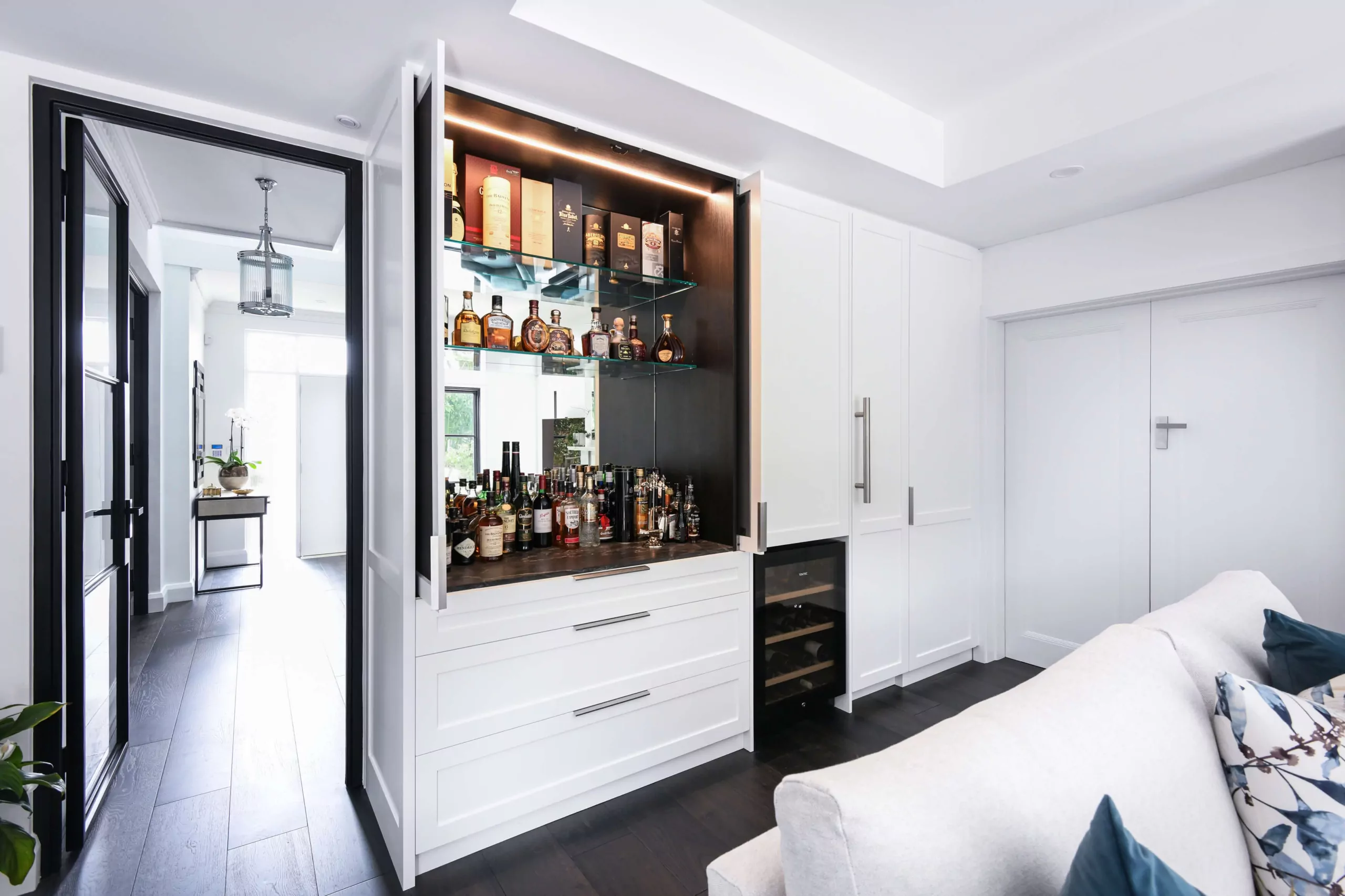 Luxury home bar with marble benchtop and mirrored display shelving | Custom joinery by Improva, Dover Heights